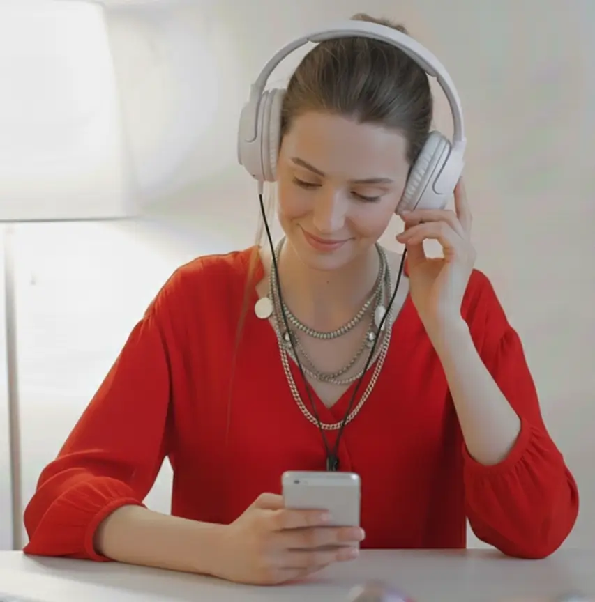 girl listening to music touching headphones
